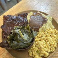 Ribs with mashed potatoes, collared greens, and Mac n cheese.  at The Wayside Cafe & Deli in Olympia