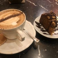 Cake and cappuccino at Bombon in Madrid