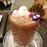 Cold chocolate with hazelnut milk, caramel and flowers at Bombon in Madrid