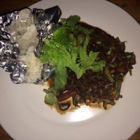 Side dishes of venduras al wok and rice  at Tierra Todo Natural in San Pedro De Atacama