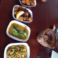 Potatoes, mushrooms  deal, peas with cashews - vegan and gluten-free, all very tasty but cery very very hot, unfortunately we couldn't finish our meal. The portions are small. at The Coconut Tree in Oxford