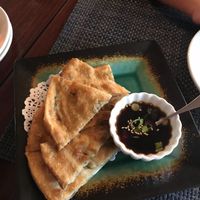 Deliciously crispy and flavorful scallion pancakes with ginger/soy sauce  at Thantawan Thai in Dracut