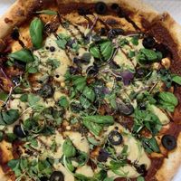 Vegan pizza in its takeout box at Nammi Plant Lab in Seoul