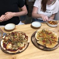 Regular pizza and hummus pizza - yum!  at Nammi Plant Lab in Seoul