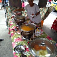 Bean+onion ball fried in dende oil(close to the camera), vatapa, caruru and pepper sauces. Shrimp not visible. at Acarajé da BaiAnna in Rio De Janeiro