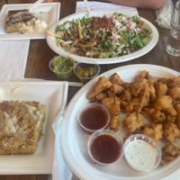 partial portions, everything is DELISHHHHHH walnut meat nacho fries & lemon pep wings  at Trio Plant-Based in Minneapolis