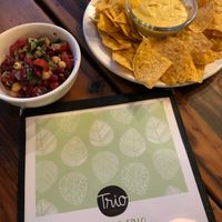 Delicious bean salad & chips and cheeze sauce   at Trio Plant-Based in Minneapolis