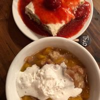 Peach Cobbler and Vanilla Cake with Strawberry Sauce - both are phenomenal  at Trio Plant-Based in Minneapolis