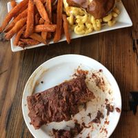 Top: Mac and Cheeze burger and sweet potato fries. Bottom: Ribs at Trio Plant-Based in Minneapolis