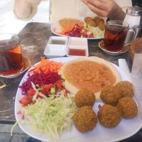 Mint tea, salad, falafel, houmous, ful and bread with dips at Falafel House in Istanbul