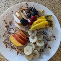 Pancakes with fruits at Leaves Cafe in Cotovia