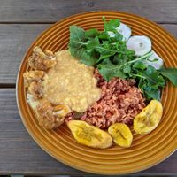 Brown rice with beets, lentil sauce, cauliflower wings with mango BBQ sauce, fried plantains, side salad at Freedom Fighters Ital Shack in Philipsburg