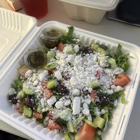 Greek salad! Had an empanada in the box in the back.  at Norma's Plant Based Cuisine in Altamonte Springs
