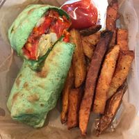 Carry out order of a Veggie Lover wrap and fries.  at Rock'n Dough Pizza in Jackson