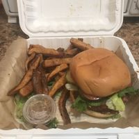 Carry out order of The Underground burger and fries. You can also request Daiya cheese for the burger.  at Rock'n Dough Pizza in Jackson