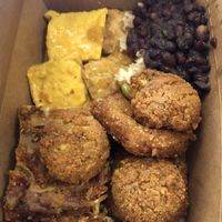 Vegan lasagna and potato cakes, falafels, tofu and beans  at Green Cuisine Vegetarian Restaurant in Victoria