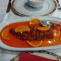 Mock chicken in orange sauce. With a glass Tsing Tao at Gran Mundo in Torremolinos