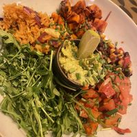 Superbowl, roasted sweet potato with guac, rocket, salsa and spicy rice   at Racconto Lounge  in Bury