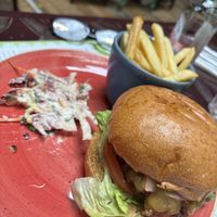Beyond burger with fries and coleslaw   at Racconto Lounge  in Bury