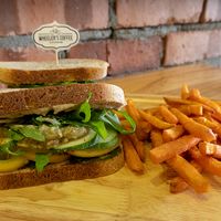 'I'm Vegan' sandwich with toasted sourdough bread, homemade pesto sauce, hummus, fresh tomato, cucumber, onion, rocket, avocado & sweet potato fries.  at Wheeler's Cafe in Penang