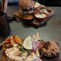 The burger and 2nd course of tapas. at Bar d'Henri in Antwerpen