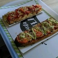 Both vegan baguettes with smoked tofu. On the bottom non-vegan basil sauce, on the top vegan tomato sauce at Długa Buła in Torun