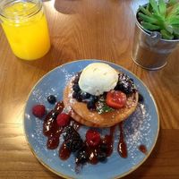 Wild berries pancakes and orange juice at Zenith in Lisbon