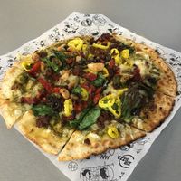Loaded pizza with vegan cheese and zero sausage at Azzip Pizza in Bloomington