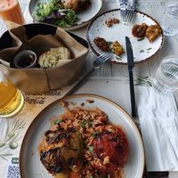Stuffed peppers, bread and olives, courgette fritters, vegan moussaka at Aubergine Cafe in Corfu