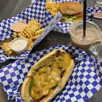 Philliy, supernova burger, fries with ranch and meta sauce, chocolate shake, and sugar cookie  at Meta Burger in Denver