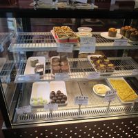Today's vegan options include the pecan, date and apricot cake, the hummus, Chocolate Delight, cherry Danish and apple cinnamon scrolls. at Himalaya Bakery and Cafe in Daylesford