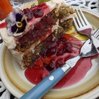 Such an incredible slice of cake. Golden beet cake with almond cream cheese frosting, and a sour cherry sauce. at Fog Eater Cafe in Mendocino