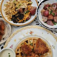 Apple fritters, scrambled tofu plate ( with slaw, potatoes and black lentils), roasted potatoes and sorghum waffles with fried cauliflower and cashew gravy. at Fog Eater Cafe in Mendocino
