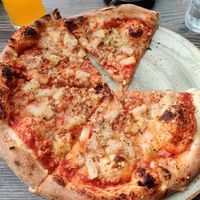 Pizza built from the toppings list (vegan ham, vegan cheese & pineapple) at Systrakaffi in Kirkjubaejarklaustur