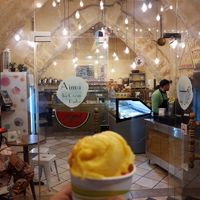 In front of the store with my mango and strawberry delight at Aima Ice Cream in Amman