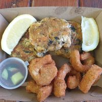 3 Thai vish cakes $5.00 special; Pair of crumbed calamari $2.20 at Northcote Fish & Chips in Northcote