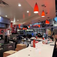 The counter where you eat. There are also shared tables. It’s a loud bustling food court environment shared with other restaurants.   at Monty's Good Burger in Riverside