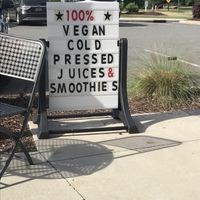 Sign makes it easy to find the storefront  at Pure Juicery Bar in Cary