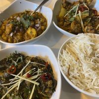 Selection of curries and onion and garlic rice  at Calcutta Club in Nottingham