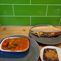 Classic Lentil & Chunky Veg, Hummus, Sweet Chilli, Sauasage, Caramelised Onion & Tomato Barra and Hazelnut and Chocolate Slice. at Domu in Bangor