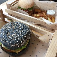 Cheesy chickpea burger and classic chickpea burger with seasoned potatoes  at Flower Burger in Rotterdam
