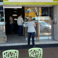Half a dozen footpath tables for wheelchair-friendly and dog-friendly alfresco dining at Belle Vue Cafe in Warwick