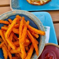 Sweet potato fries (veggie burger in the back) at King's Caffe in Malinska
