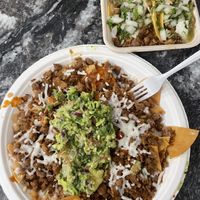Asada loaded nachos with vegan cheese and asada + al pastor tacos  at Borreguitas in Pomona