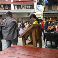 Outdoor seating on the corner of west street at Pure Lotus in Yangshuo
