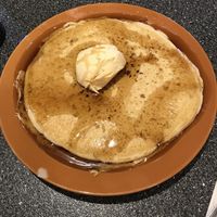Old fashioned vegan pancake topped with vegan butter and maple syrup  at Batter Up Pancakes in Fresno