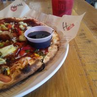 I ordered the regular crust with vegan cheese and basically all the veggies! They have things like roasted broccoli, corn, and artichoke hearts ?. They also have regular toppings like mushroom, bell pepper, olives, etc. I add bbq drizzle to mine. This last time, I tried the fig balsamic glaze on the side... Drool worthy! at Mod Pizza in Riverside