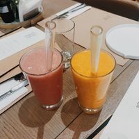 strawberry and banana smoothie, mango and peaches smoothie with glass straws! at Baker and Spice in Kuwait City