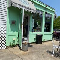 Outdoor seating area and exterior of building  at Juicygreens in Jamaica Plain