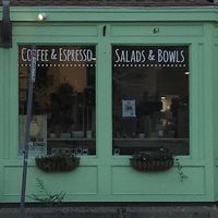 Storefront at night at Juicygreens in Jamaica Plain